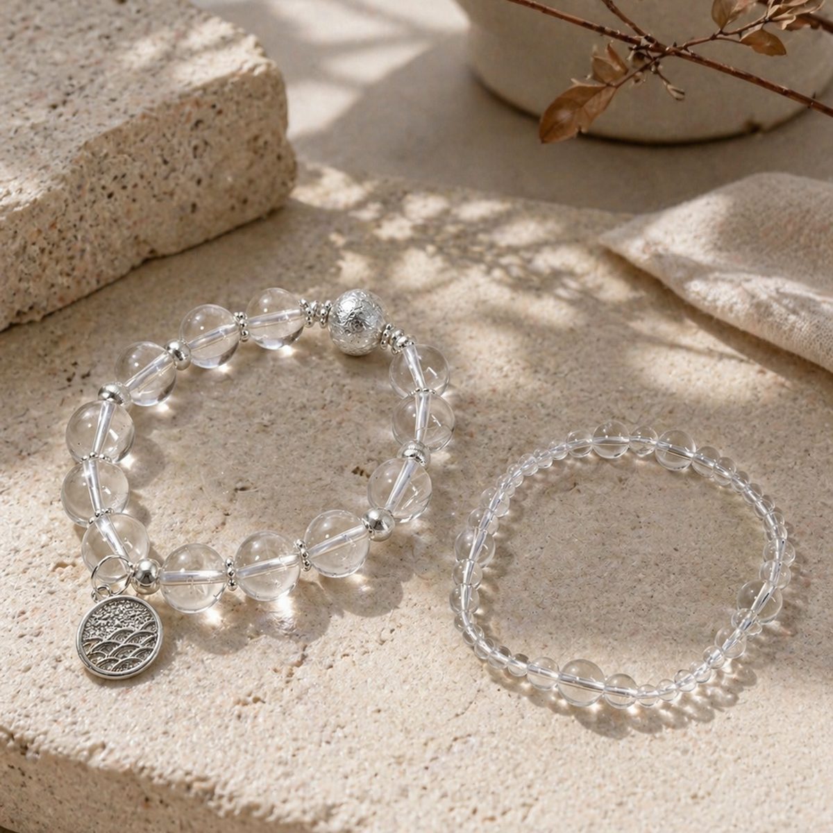 Clear quartz crystal bracelets in a soft natural setting by Veyra Grove
