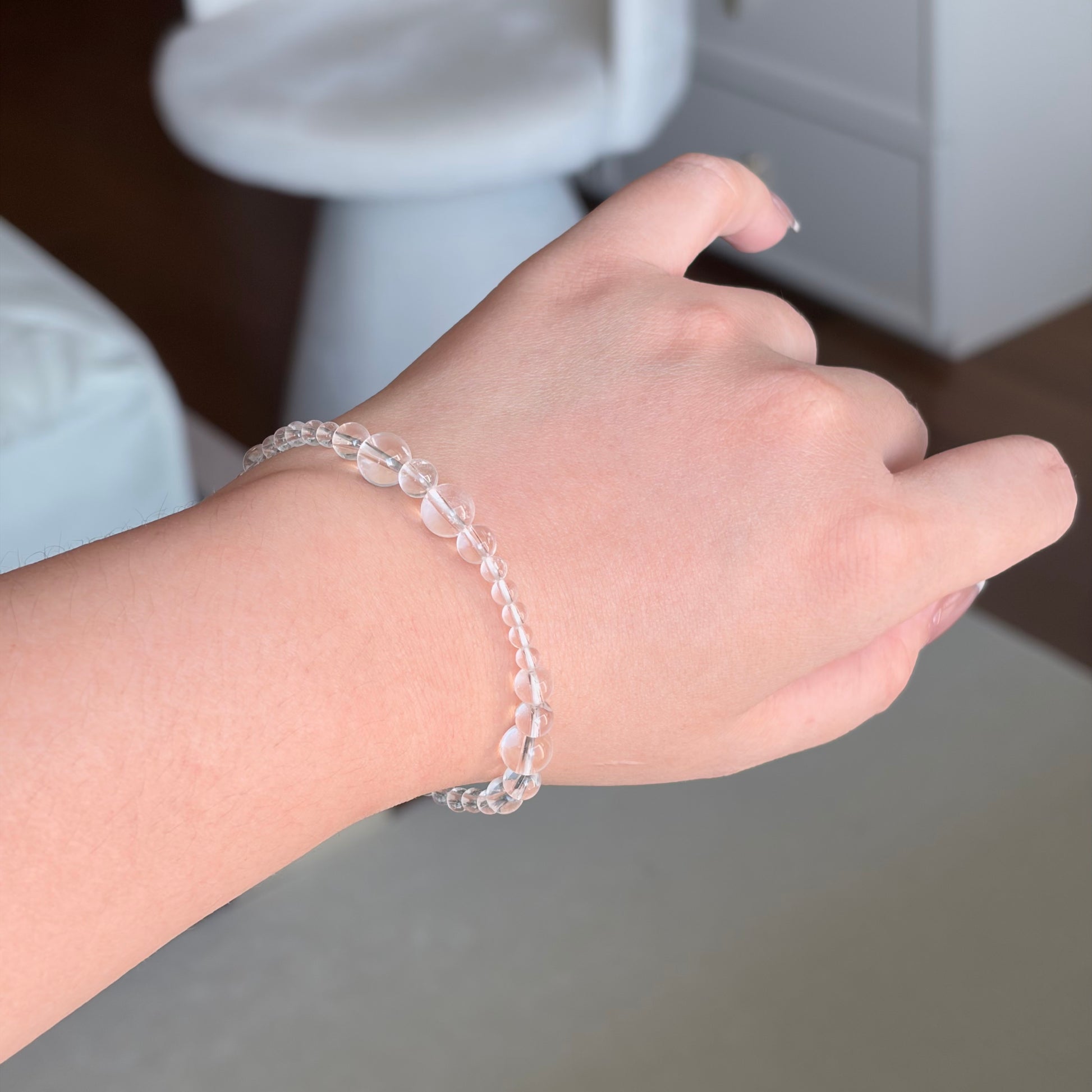 Clear Quartz Silver Veil Bracelet worn on the wrist in soft natural light, a Metal element mixed-bead clear quartz bracelet with a delicate, barely-there crystal look.