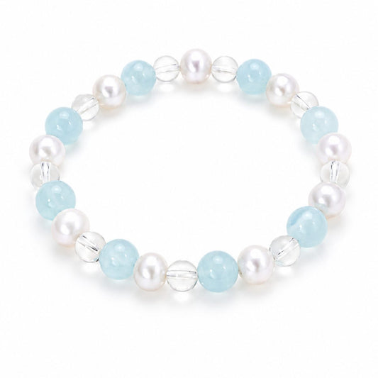 Clear quartz freshwater pearl bracelet with pale blue beads on white background by Veyra Grove