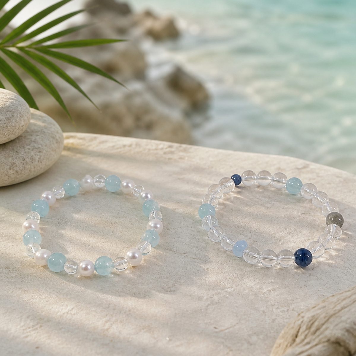 Blue kyanite moonstone bracelet styled on sand with clear water and soft coastal light